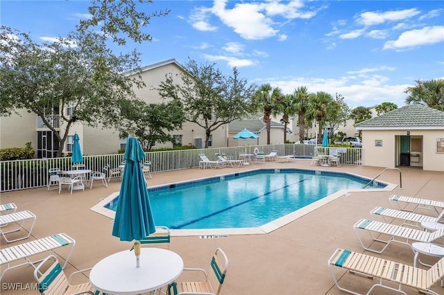 4965 Sandra Bay Dr Unit 103, Naples, FL 34109 - community pool featuring a patio area and fence