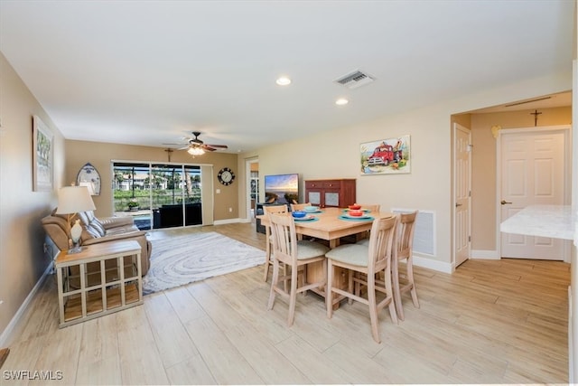 dining area featuring ceiling fan and light hardwood / wood-style floors