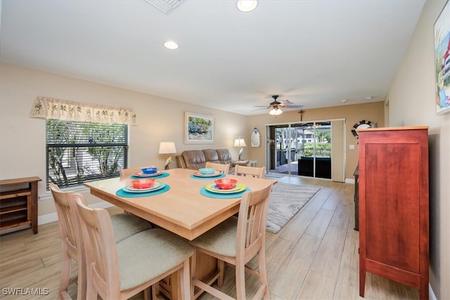 dining room featuring ceiling fan and light hardwood / wood-style floors