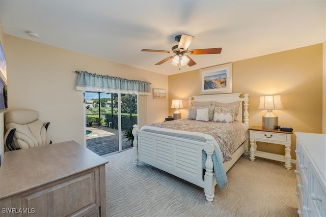 carpeted bedroom featuring access to outside and ceiling fan