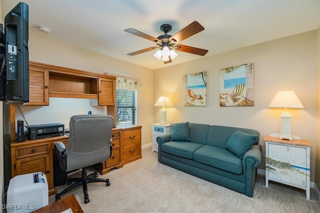 office with light carpet and ceiling fan