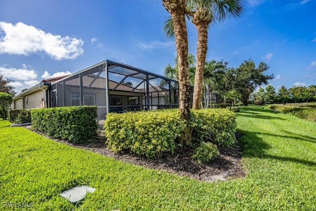 view of yard with a lanai