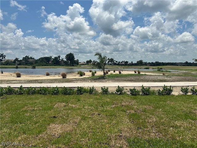 view of yard featuring a rural view and a water view