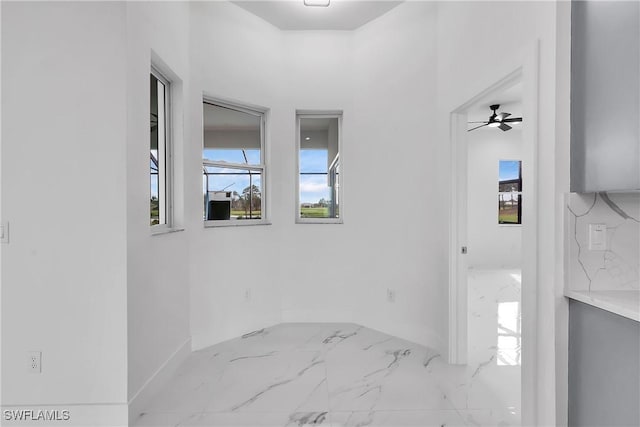 interior space featuring ceiling fan