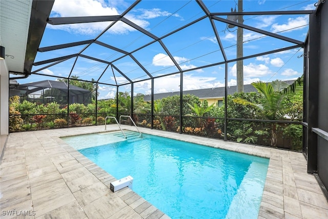 view of pool featuring a lanai and a patio