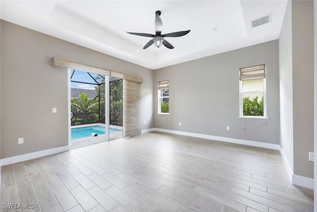 spare room featuring ceiling fan and light wood-type flooring