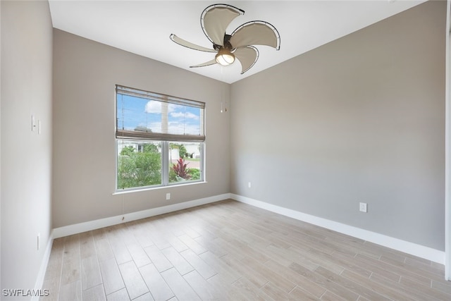 spare room featuring light hardwood / wood-style floors and ceiling fan