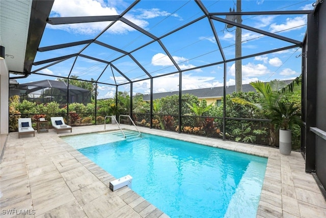 view of pool featuring a lanai and a patio area