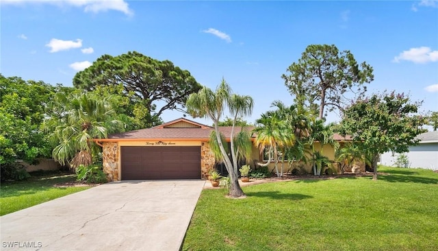 ranch-style home with an attached garage, stone siding, concrete driveway, and a front yard