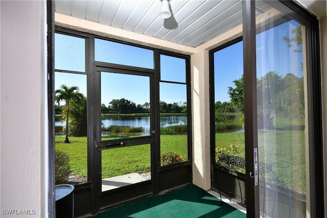 sunroom with a water view