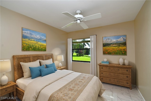 tiled bedroom with ceiling fan