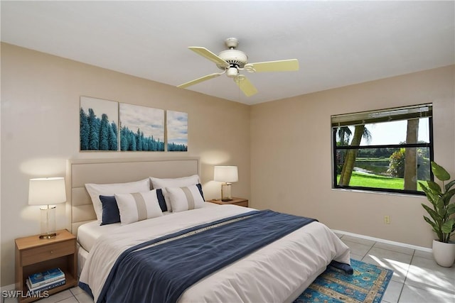 bedroom with light tile patterned floors and ceiling fan