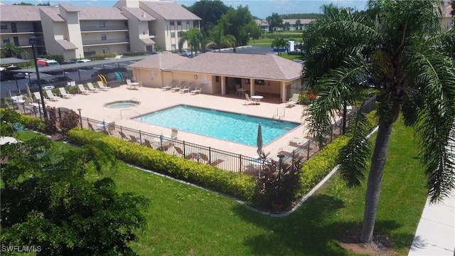 view of swimming pool with a community hot tub and a patio