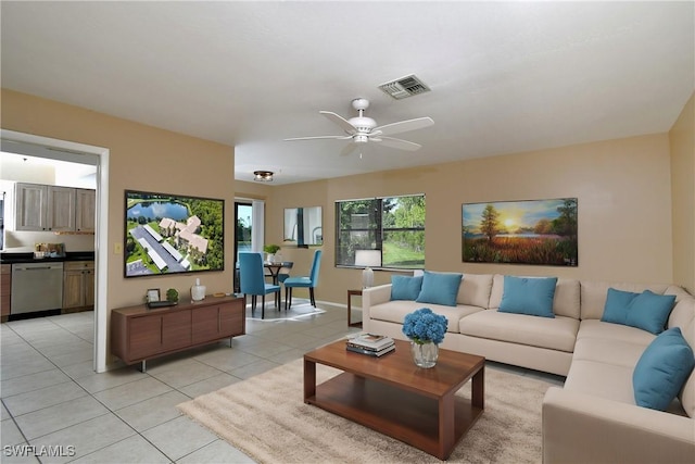 tiled living room with ceiling fan