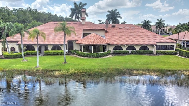 exterior space featuring a water view and a yard