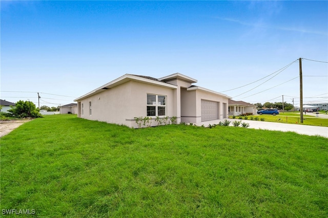 view of property exterior with a garage and a lawn