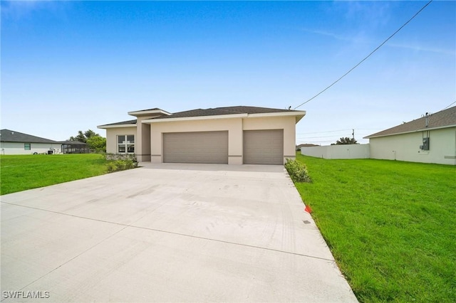 prairie-style house featuring an attached garage, driveway, a front lawn, and stucco siding