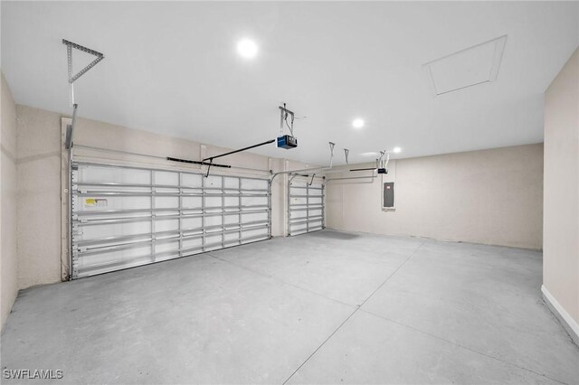 garage featuring a garage door opener and electric panel