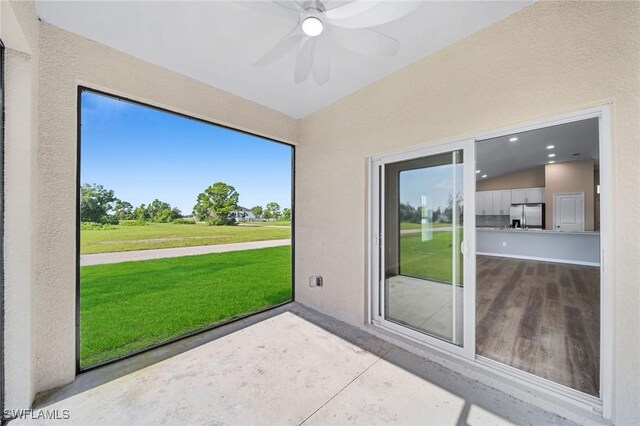 view of patio featuring ceiling fan