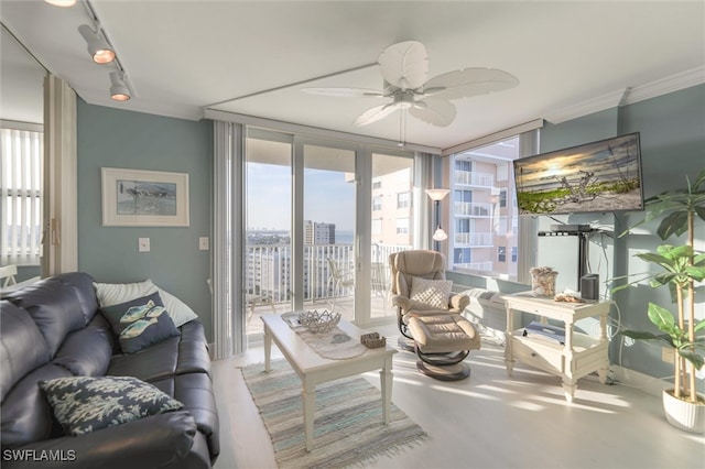 living room featuring floor to ceiling windows and ceiling fan