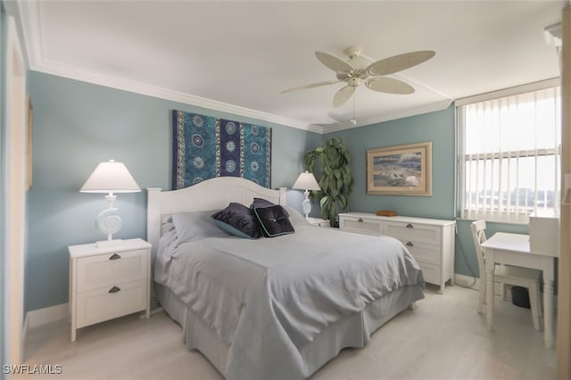 bedroom with crown molding, ceiling fan, and light colored carpet