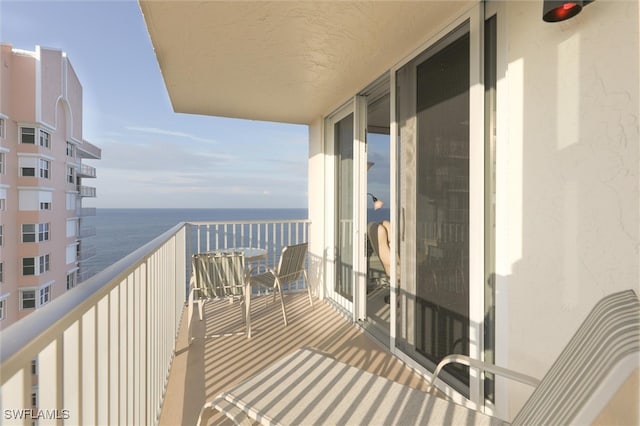 balcony featuring a water view