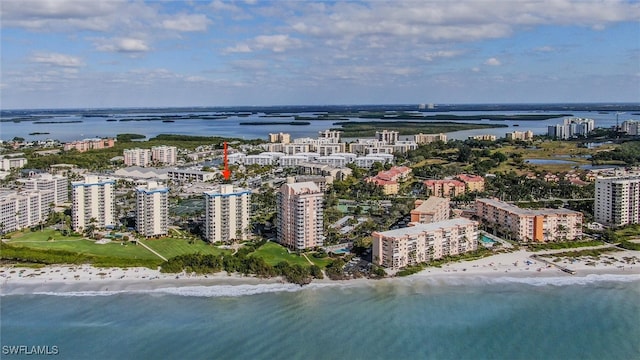 bird's eye view featuring a view of the beach and a water view