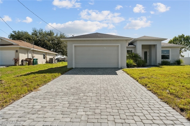 view of front facade with a front lawn and a garage