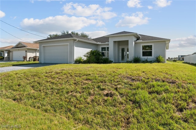 view of front of house featuring a garage and a front yard