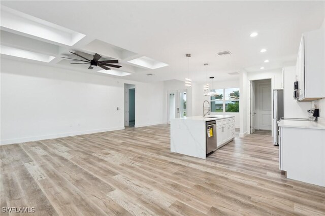 kitchen with sink, light hardwood / wood-style flooring, coffered ceiling, stainless steel appliances, and white cabinets