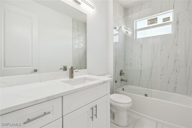 full bathroom featuring tile patterned flooring, vanity, tiled shower / bath combo, and toilet