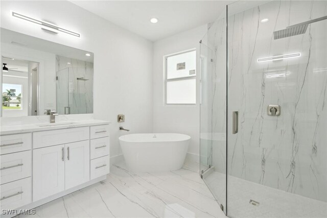 bathroom featuring independent shower and bath, vanity, and tile patterned floors