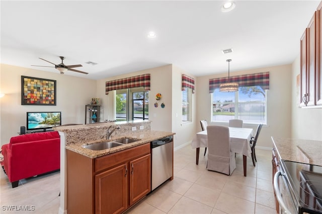 kitchen with sink, a kitchen island with sink, stainless steel dishwasher, ceiling fan, and light tile patterned floors