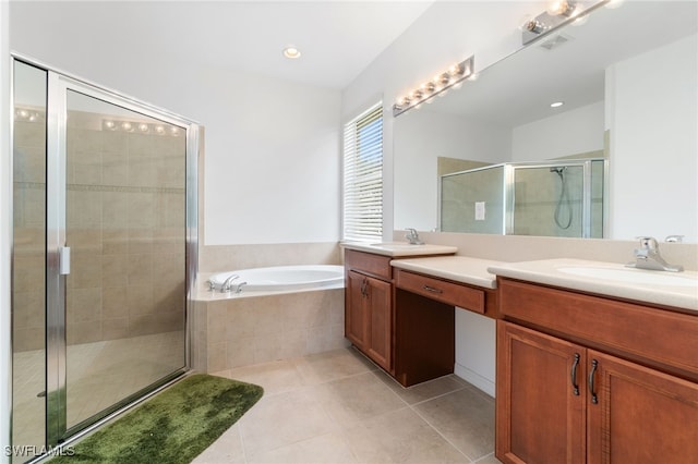 bathroom featuring tile patterned flooring, independent shower and bath, and dual vanity