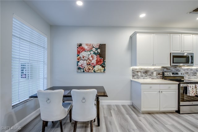 dining room featuring light hardwood / wood-style flooring