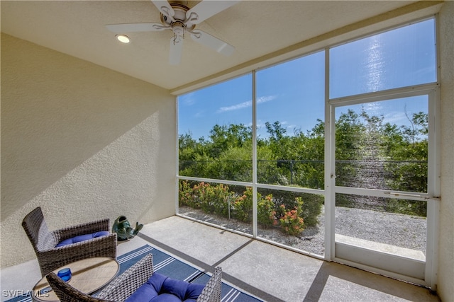 sunroom / solarium with ceiling fan