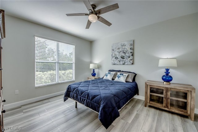 bedroom featuring ceiling fan and light hardwood / wood-style floors