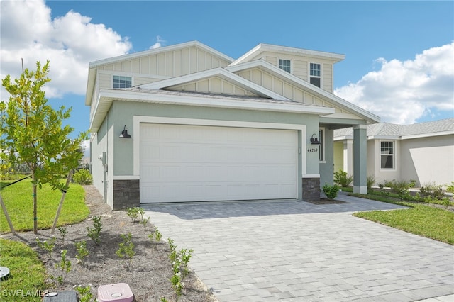 craftsman-style house with a front lawn and a garage