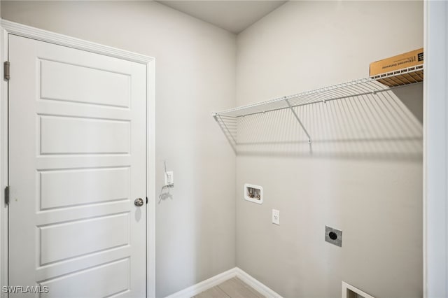 clothes washing area featuring washer hookup and electric dryer hookup