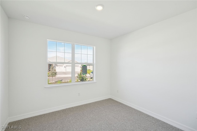 carpeted empty room with plenty of natural light