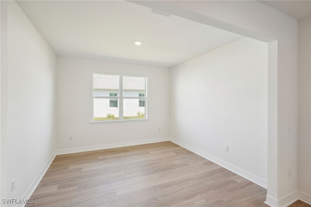 unfurnished room featuring light wood-type flooring