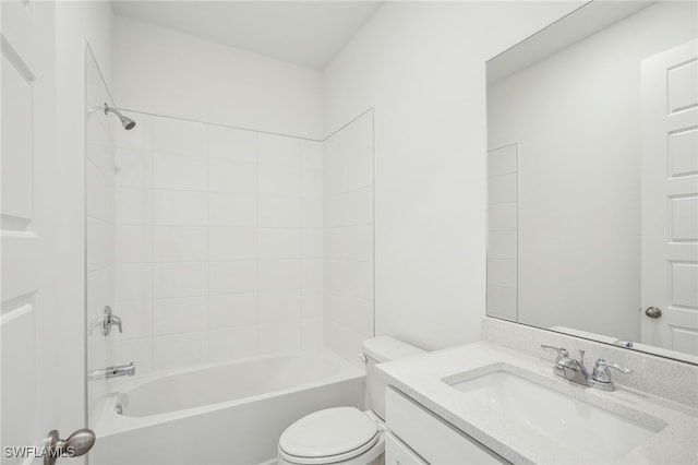 full bathroom with tiled shower / bath combo, vanity, and toilet