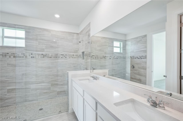 bathroom featuring vanity and an enclosed shower