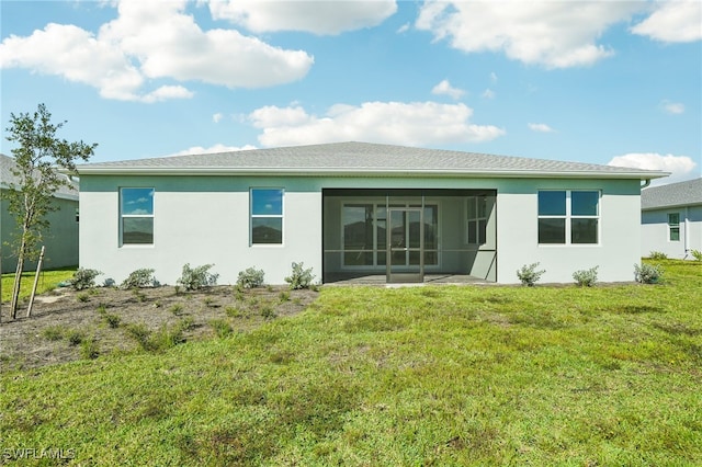 rear view of house with a patio area and a yard