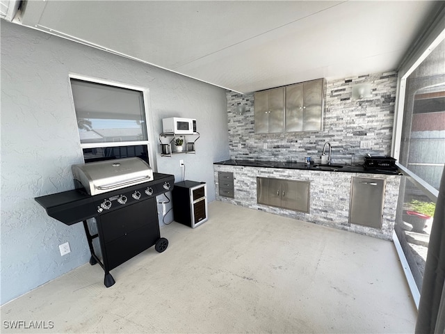 kitchen featuring sink and gray cabinetry