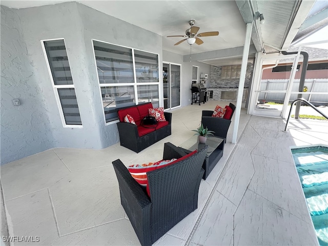 view of patio / terrace with ceiling fan and outdoor lounge area