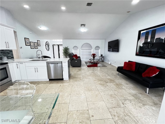 kitchen featuring decorative backsplash, white cabinetry, light tile patterned floors, sink, and stainless steel appliances