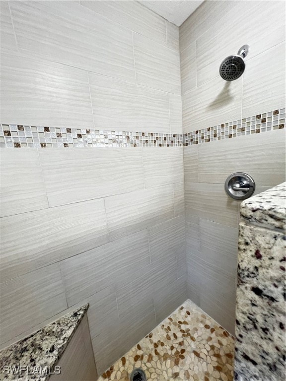 bathroom with tiled shower