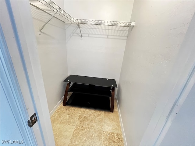 walk in closet featuring light tile patterned floors