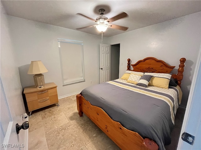 bedroom with light tile patterned flooring and ceiling fan